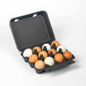 Open black vintage-style 12-egg chicken carton filled with mixed eggs.