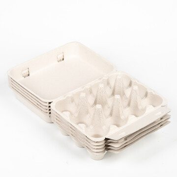 Open grey vintage-style 12-egg chicken cartons stacked.