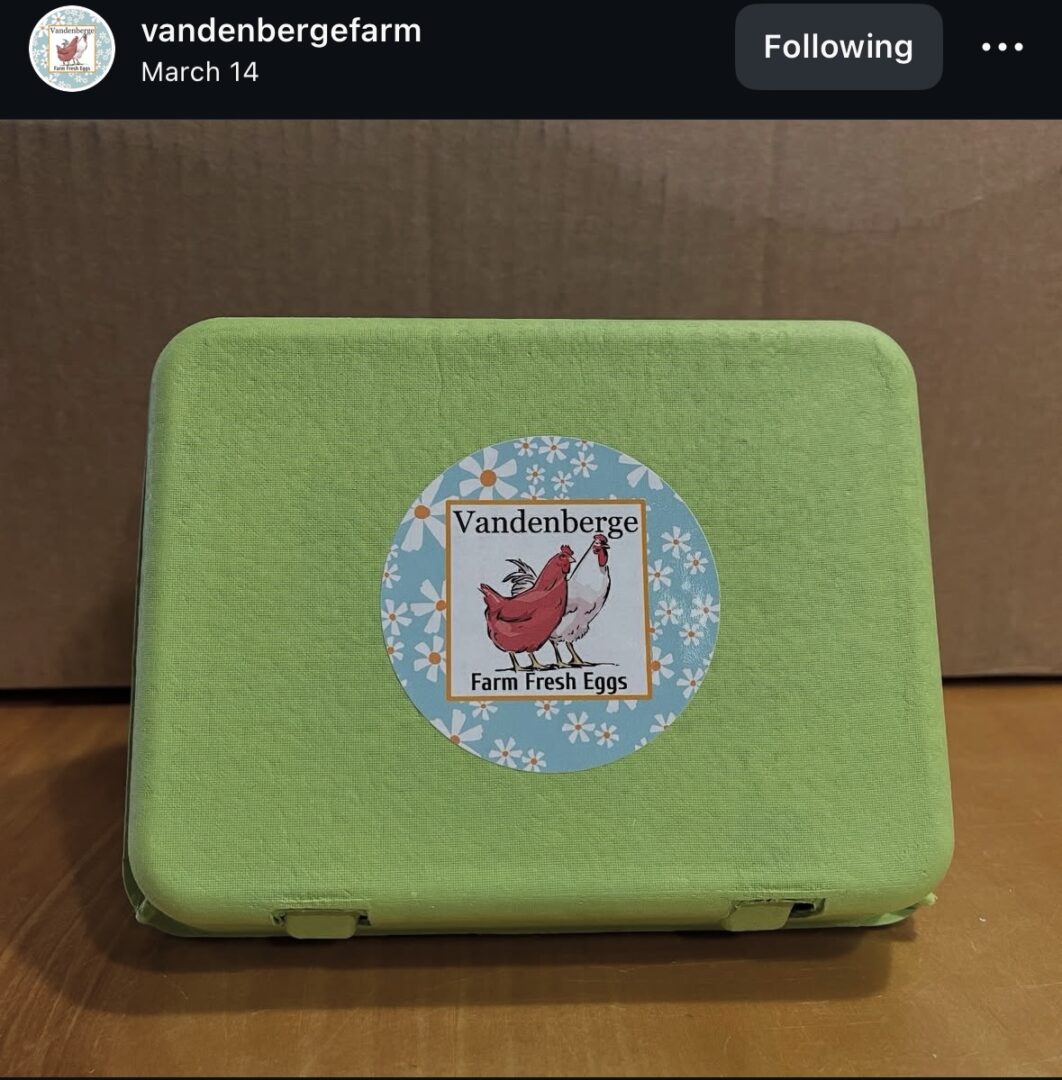 Green egg carton with farm logo sticker.