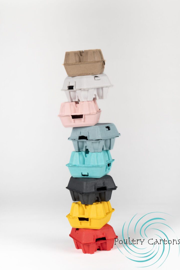 Stack of colorful Sunny Side Up Yellow Paper Pulp Chicken Egg Cartons (4 eggs) arranged in a tower on a white background.